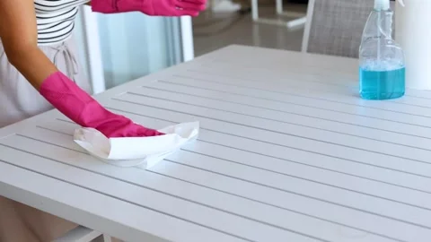 Efficient Table Cleaning with Spray and Wipe Technique Stock Footage 312186683