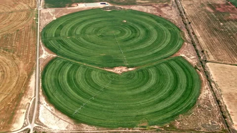 Efficient watering systems create green spirals on arid land. Stock Footage 257337586