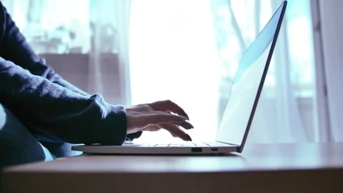 Efficient Work Environment: Woman Working on Laptop in a Tranquil Office with a Stock Footage 329936872