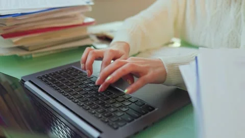 Efficient Work A Woman's Expert Hands Typing on a Laptop in a Home Office Stock Footage 274103142
