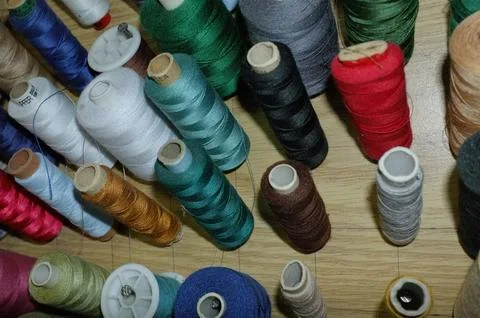 Efficient Workshop Display With Neatly Arranged Multicolored Sewing Threads.. Stock Photos
