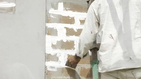 Efficiently Enhancing Walls - Expert Plastering Techniques in Action 스톡 동영상 314484009