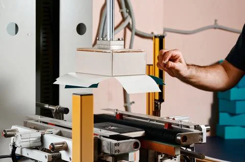 Efficiently wrapping rectangular boxes with a state-of-the-art semi-automatic Stock Photos