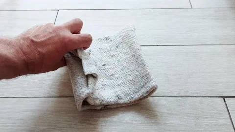 Effortless Prep: Unfolding a Floor Rag for Quick Cleaning Moments Stock Footage 312733425