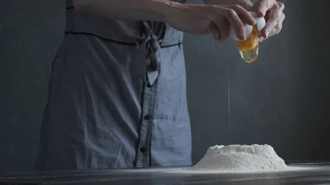 The egg is added to the flour Stock Footage 106571408