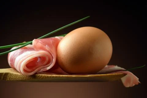 Egg and bacon on the spoon Stock Photos