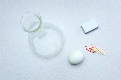 Egg and bottle experiment Stock Photos