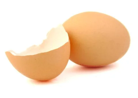 Egg and broken egg on white background. Stock Photos