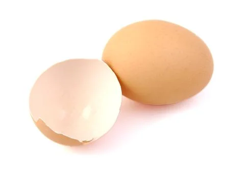 Egg and broken egg on white background. Stock Photos