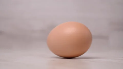 Egg are rolling on the table. Easter eggs background. Stock Footage 130409565