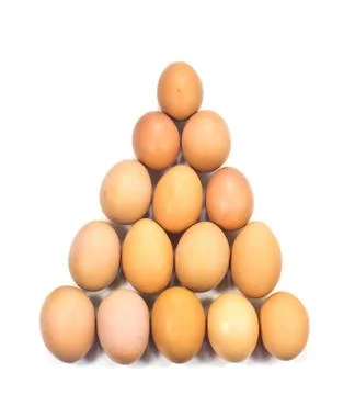 Egg arranged in triangle on white background Stock Photos
