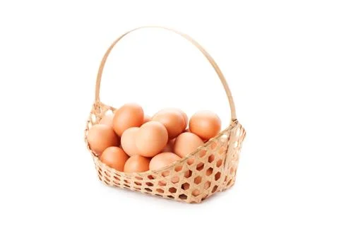 Egg in basket Stock Photos