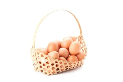 Egg in basket Stock Photos