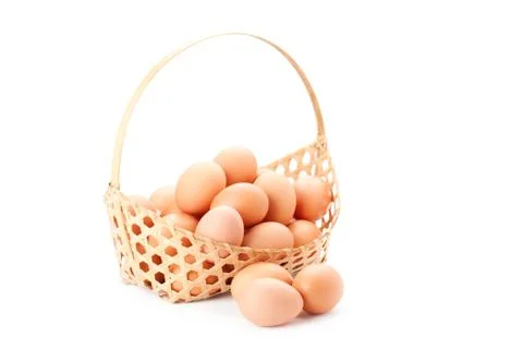Egg in basket Stock Photos