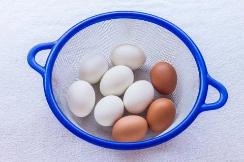 Egg in basket Stock Photos
