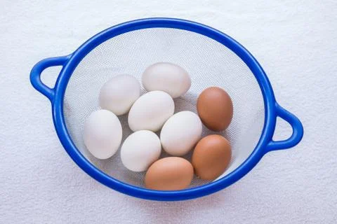 Egg in basket Stock Photos