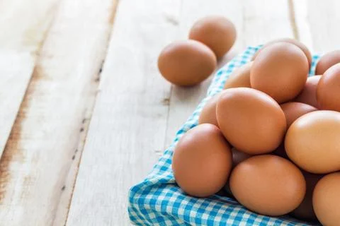 Egg in basket Stock Photos