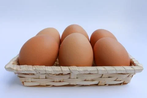 Egg in basket wicker Foto stock