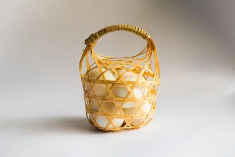 Egg in basket wicker on white background,Duck eggs in baskets . Foto stock