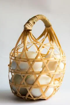 Egg in basket wicker on white background,Duck eggs in baskets . Stock Photos