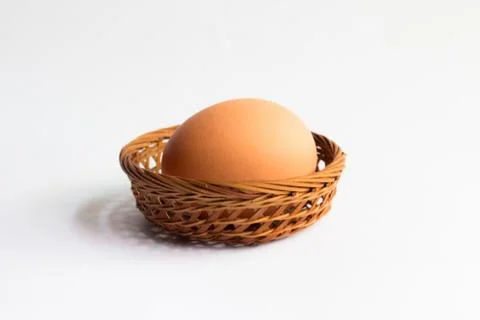 Egg in basket wicker on white background,Duck eggs in baskets . Stock Photos