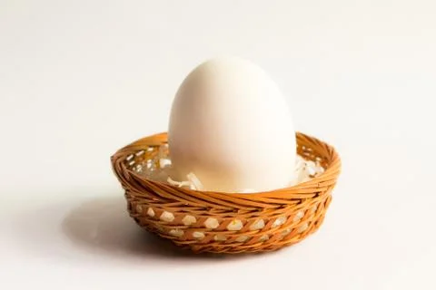 Egg in basket wicker on white background,Duck eggs in baskets . Stock Photos