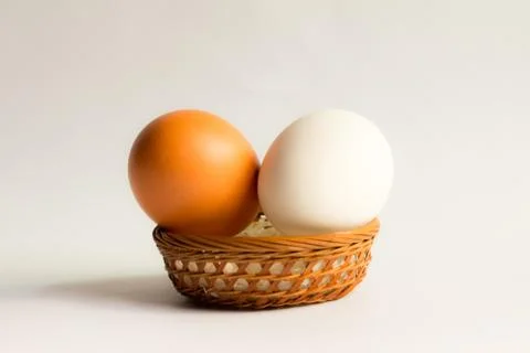 Egg in basket wicker on white background,Duck eggs in baskets . Stock Photos