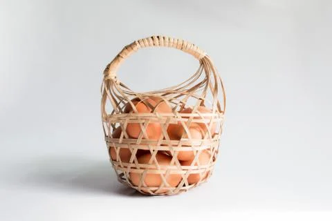 Egg in basket wicker on white background,Duck eggs in baskets . Stock Photos