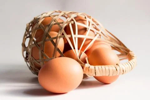 Egg in basket wicker on white background,Duck eggs in baskets . Stock Photos
