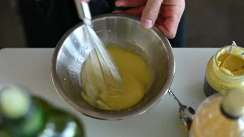Egg-Beating Mastery: Chef's Hands Create Culinary Delight 動画素材 243357292