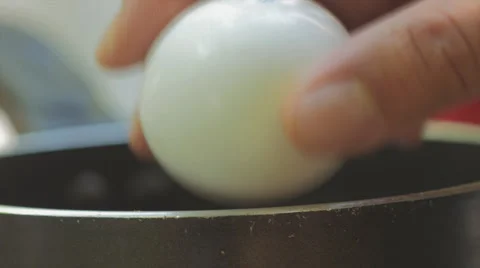 Egg Being Crack Into Pan Closeup Macro Stock-Footage 65758101