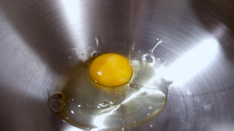 Egg being cracked Stock Footage 251847354