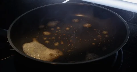Egg being fried in pan Stock Footage 96877391