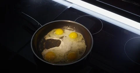 Egg being fried in pan Stock Footage 96878050