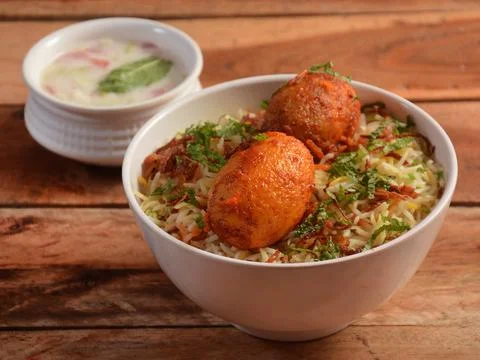 Egg Biryani - Basmati rice cooked with masala roasted eggs and spices and ser Stock Photos