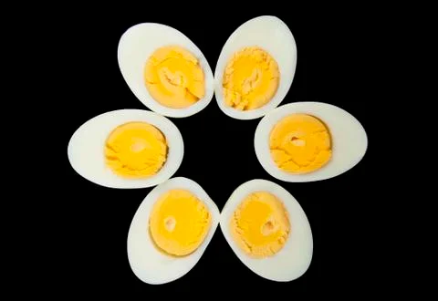 Egg on black Stock Photos