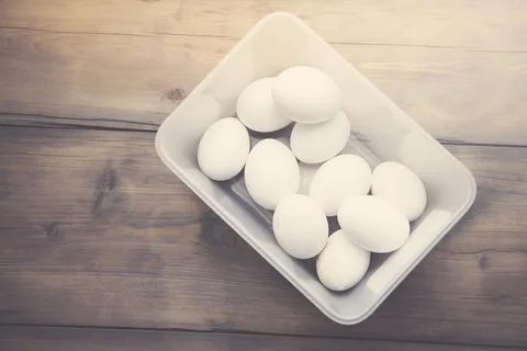 Egg on bowl on table Stock Photos