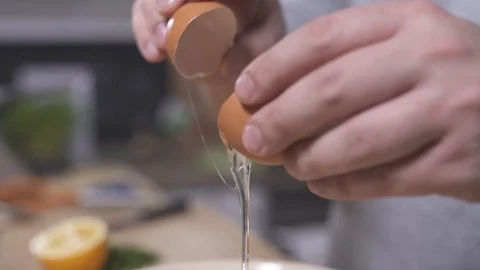 Egg braking close up Stock Footage 127360216