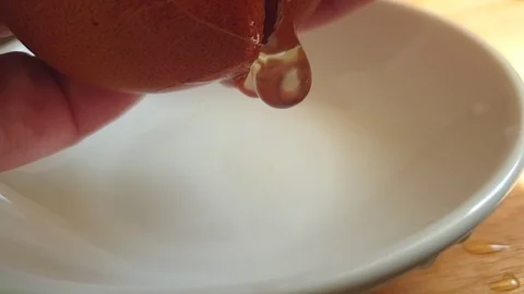 Egg break, slow motion Stock Footage 106187441