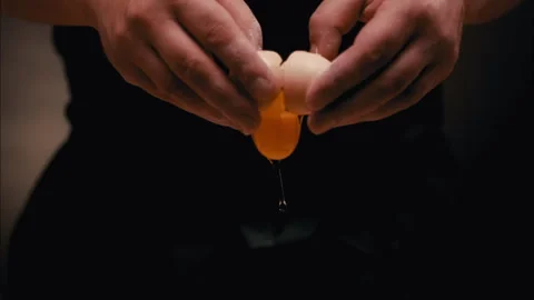 Egg Breaking by Hands into the Flour and yolk dropping Stock Footage 254934428