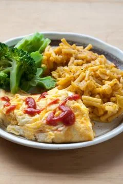Egg, broccoli, macaroni and cheeese lunch plate Stock Photos