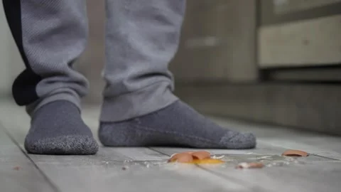 Egg broken on the floor macro slow motion 動画素材 253036965