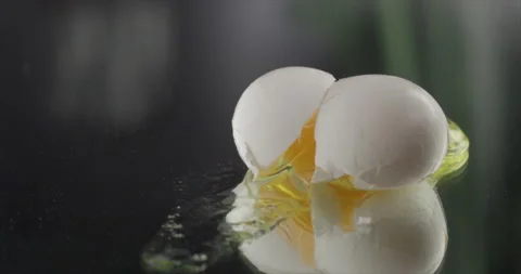 An egg is broken on a mirror surface Stock Footage 200254905
