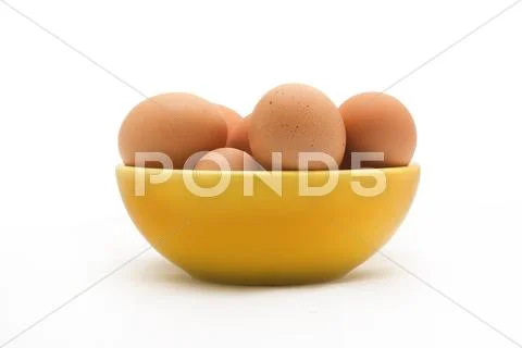 Egg, Brown Eggs in Yellow Plate, Isolated on White Background Stock Photos