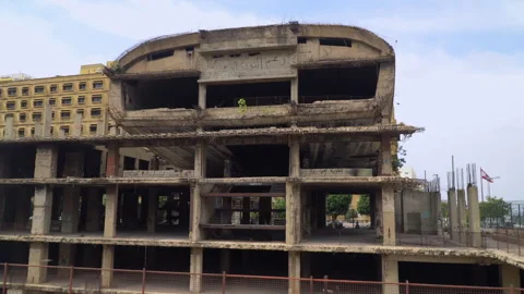 The "Egg" building, an unfinished and abounded building in central Beirut Stock Footage 254181635