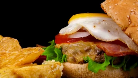 Egg Burger with Beef and Fried Potato wedges, close-up view Stock Footage 84652400