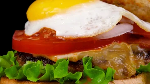 Egg Burger with Beef, cheese and tomato sauce, close-up view Stock Footage 84652997