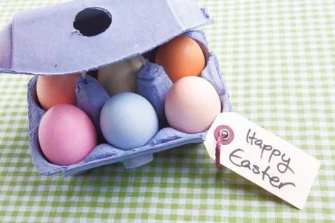 Egg carton with different colored eggs Stock Photos