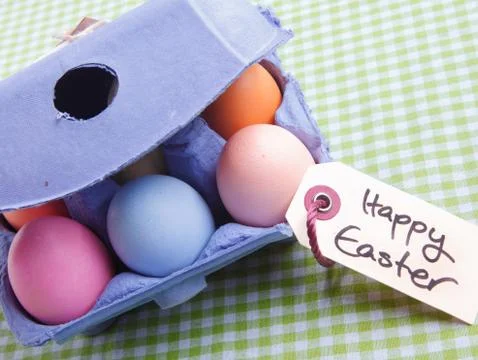 Egg carton with different colored eggs Stock Photos