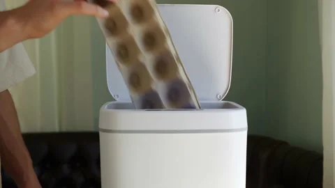 The egg carton made of pulperboard is thrown into the trash. Recycling of paper Stock Footage 219225148